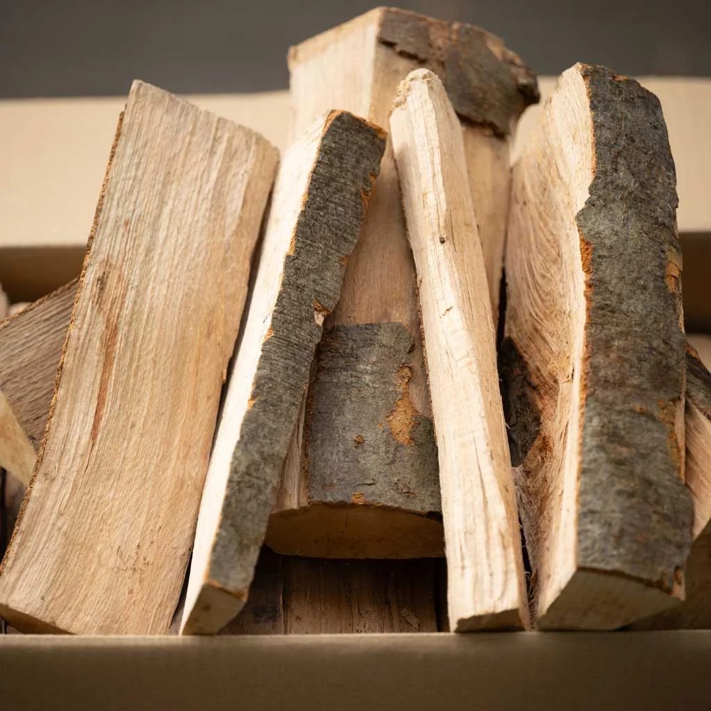 Bois de chauffage en carton, sac ou filet